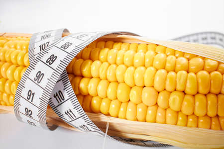fresh corn with measuring tapeの写真素材