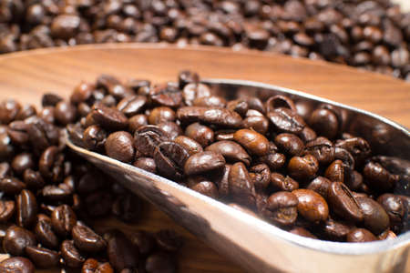 coffee beans in the spoonの写真素材