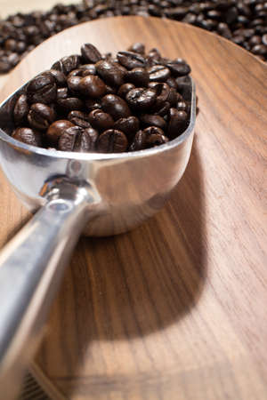 coffee beans in the spoonの写真素材