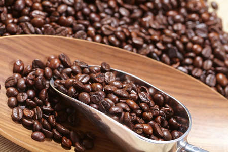 coffee beans in the spoonの写真素材