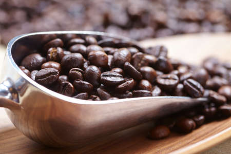 coffee beans in the spoonの写真素材