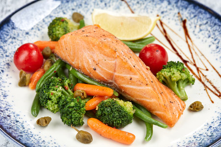 salmon steak with roasted vegetablesの写真素材