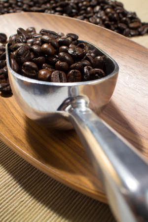 coffee beans in the spoonの写真素材