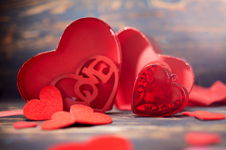 Valentine day greeting card. Hearts on the wooden backgroundの写真素材