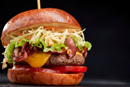 tasty burger with beef cutlet and vegetablesの写真素材
