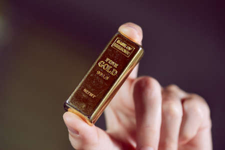golden bar on the man's handの写真素材