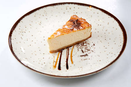 tasty cheesecake with chocolate sauceの写真素材