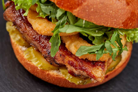 tasty burger with beef cutlet and vegetablesの写真素材