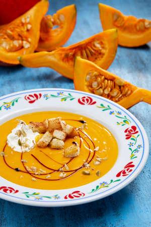 pumpkin cream soup with croutonsの写真素材