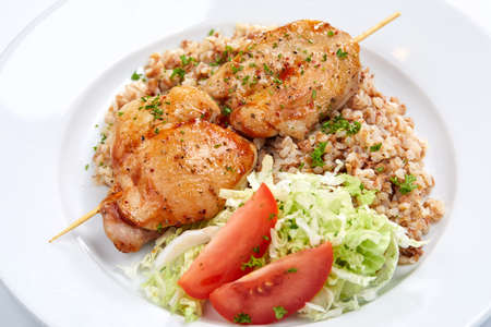 chicken kebab with buckwheat and saladの写真素材