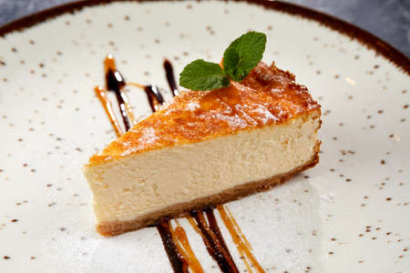 tasty cheesecake with chocolate sauceの写真素材