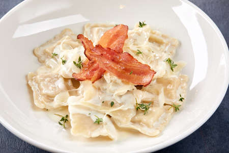 italian ravioli with bacon and cheeseの写真素材