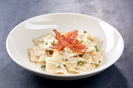 italian ravioli with bacon and cheeseの写真素材
