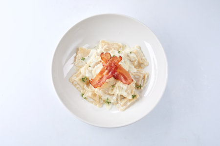 italian ravioli with bacon and cheeseの写真素材