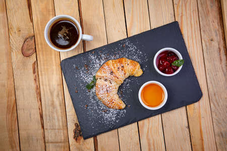croissant with butter and jamの写真素材