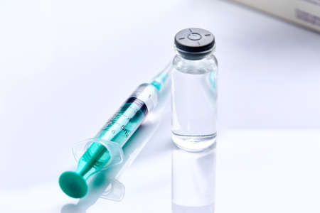 Vaccine in vial with syringeの写真素材