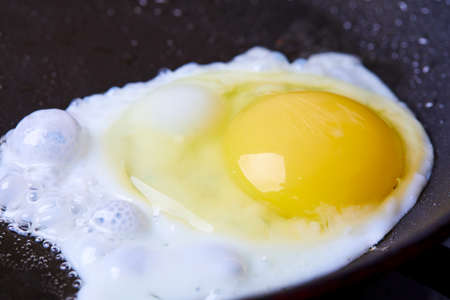 Fried egg on the whiteの写真素材
