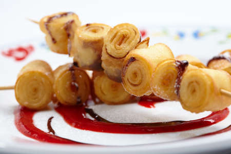 fried sweet rolls with berry sauceの写真素材