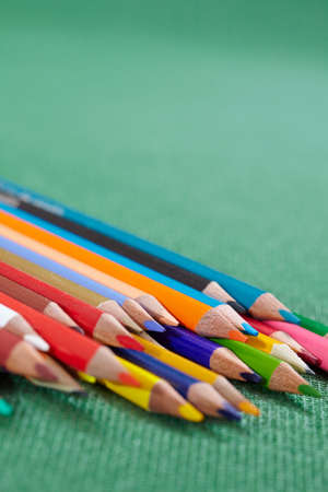 color pencils on the green textureの写真素材