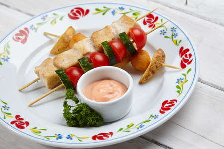 chicken kebab with baked potatoesの写真素材