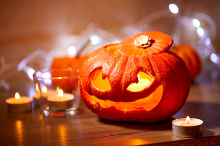 Halloween pumpkin and tea candleの写真素材