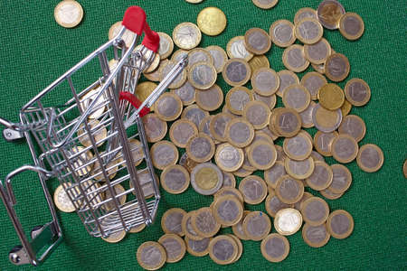 coins in the shopping basketの写真素材