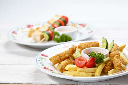 Chicken nuggets with french friesの写真素材