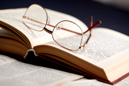 glasses on the book pagesの写真素材