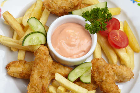 Chicken nuggets with french friesの写真素材