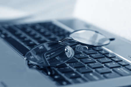 glasses on the keyboardの写真素材