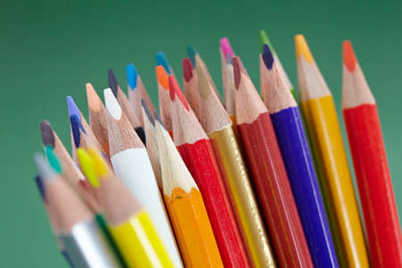 color pencils on the green textureの写真素材