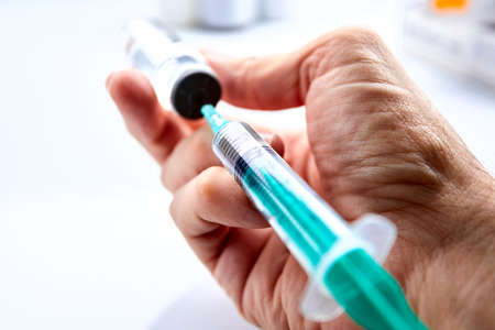 Vaccine in vial with syringeの写真素材
