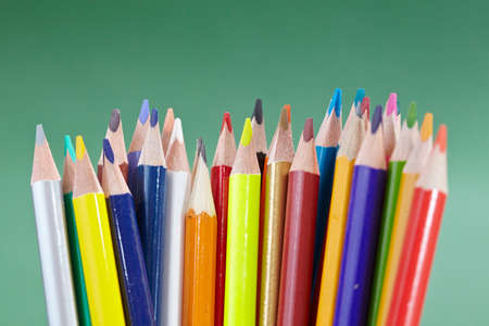 color pencils on the green textureの写真素材