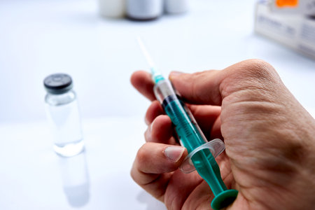 Vaccine in vial with syringeの写真素材