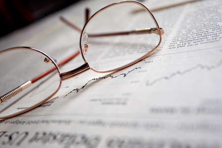eyeglasses on the newspaper pagesの写真素材