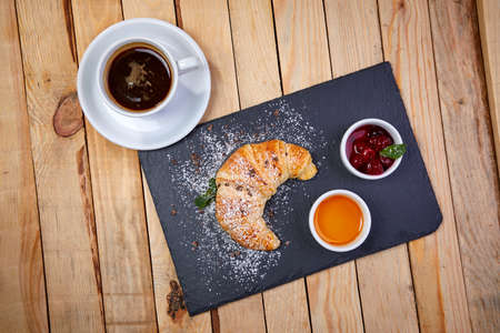 croissant with butter and jamの写真素材