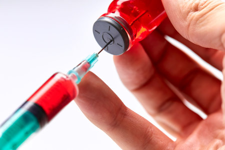 Vaccine in vial with syringeの写真素材