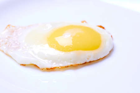 Fried egg on the whiteの写真素材