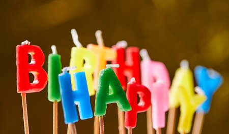 birthday candles on the yellow backgroundの写真素材