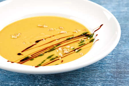 pumpkin cream soup with sauceの写真素材