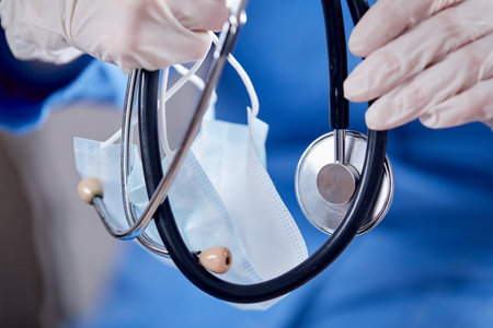doctor with stethoscope and maskの写真素材