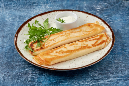 tasty breakfast with pancakes and herbsの写真素材