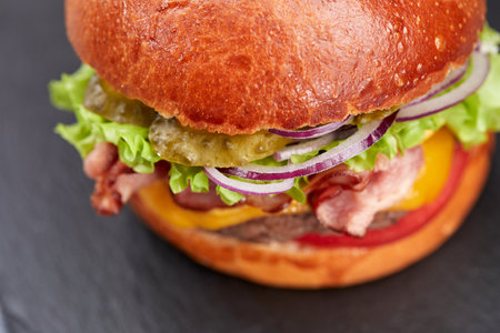 tasty burger with beef cutlet and vegetablesの写真素材
