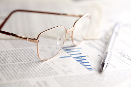 eyeglasses on the newspaper pagesの写真素材