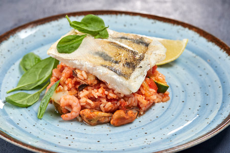 white fish with rice and vegetablesの写真素材