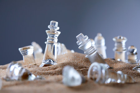 glass chess on the sandの写真素材