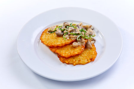 potato pancakes with mushrooms and herbsの写真素材