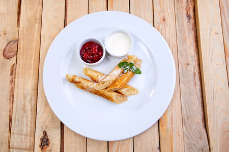 pancakes with jam and sour creamの写真素材