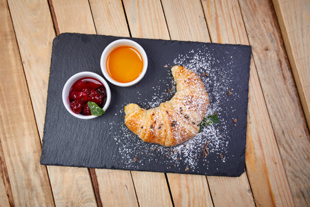 croissant with butter and jamの写真素材