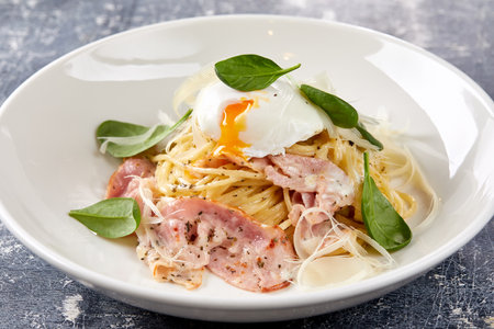 Carbonara pasta. Spaghetti with pancetta, egg, parmesan cheese and cream sauceの写真素材